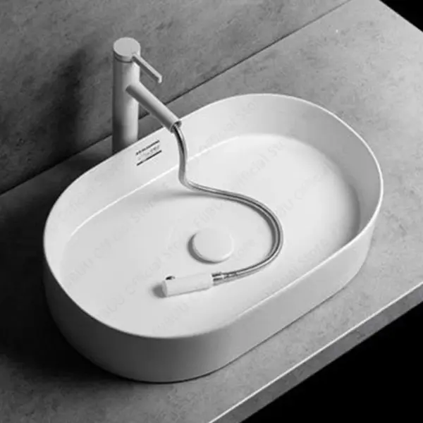 White Ceramic Above Counter Sink Modern Simple Oval Bathroom Sink Washroom and Balcony Artistic Wash Basin for Home Office Use